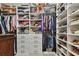 Organized walk-in closet with shelving, drawers, and hanging space for clothing at 2648 Lake Manor Dr, Land O Lakes, FL 34639