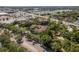 A condo community with lush landscaping, a pond, and easy access to shopping and highways in a sunny, aerial view at 2650 Countryside Blvd # C204, Clearwater, FL 33761