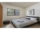 Well-lit bedroom with a large window offering natural light, closet and neutral decor at 2650 Countryside Blvd # C204, Clearwater, FL 33761