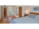 Comfortable bedroom with ensuite, spacious closet and wood-look floors for a modern touch at 2650 Countryside Blvd # C204, Clearwater, FL 33761