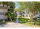 Well maintained apartment building with lush landscaping and marked loading zones in a desirable community at 2650 Countryside Blvd # C204, Clearwater, FL 33761