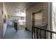 Exterior hallway view with an elevator and railing overlooking a garden area at 2650 Countryside Blvd # C204, Clearwater, FL 33761