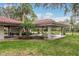 A shaded outdoor pavilion with seating offers a pleasant communal space within the landscaped grounds at 2650 Countryside Blvd # C204, Clearwater, FL 33761
