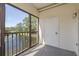Screened-in patio overlooking a serene lake with a fountain and lush green landscaping at 2650 Countryside Blvd # C204, Clearwater, FL 33761