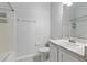 Clean bathroom featuring a sink, toilet and bath and shower combination and a large mirror at 27563 Pleasure Ride Loop, Wesley Chapel, FL 33544