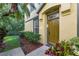 Inviting home exterior with a well-kept lawn and a charming front door and entryway at 27563 Pleasure Ride Loop, Wesley Chapel, FL 33544