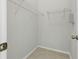 Neat walk-in closet with shelves perfect for organizing clothes and accessories at 27563 Pleasure Ride Loop, Wesley Chapel, FL 33544