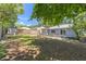 Large backyard with wood fence, storage shed, mature trees, and patio at 2770 Steeple Ct, Palm Harbor, FL 34684