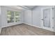 Bright dining room with large window and a decorative wine cellar door at 2770 Steeple Ct, Palm Harbor, FL 34684