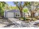 Charming single-story home with attached garage and beautiful landscaping at 2770 Steeple Ct, Palm Harbor, FL 34684