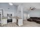 Bright kitchen featuring white cabinets, stainless steel appliances, and an open layout at 2770 Steeple Ct, Palm Harbor, FL 34684