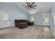 Inviting living room with high ceilings, a ceiling fan, and modern flooring at 2770 Steeple Ct, Palm Harbor, FL 34684