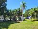Community playground area featuring modern play equipment and lush landscaping at 2770 Steeple Ct, Palm Harbor, FL 34684