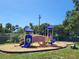 A colorful community playground with slides, bridges, and ample space for recreational activities at 2770 Steeple Ct, Palm Harbor, FL 34684
