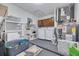 Utility room includes washer and dryer, storage shelves, and painted floor at 2770 Steeple Ct, Palm Harbor, FL 34684