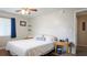 Neutral bedroom with a ceiling fan, natural light, and wooden side tables at 2941 Lichen Ln # B, Clearwater, FL 33760