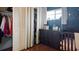 Bedroom with closet, dark wood dresser, and a decorated wall with stars and moon at 2941 Lichen Ln # B, Clearwater, FL 33760