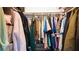 Walk-in closet offers ample storage space with shelving and racks filled with clothing at 2941 Lichen Ln # B, Clearwater, FL 33760