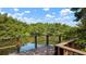 Relaxing waterfront deck overlooking a tranquil river surrounded by vibrant trees at 2941 Lichen Ln # B, Clearwater, FL 33760