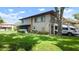 Two-story condo with an attached garage and manicured landscaping at 2941 Lichen Ln # B, Clearwater, FL 33760