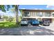 Condo exterior featuring a private garage and parking for multiple vehicles at 2941 Lichen Ln # B, Clearwater, FL 33760