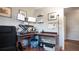 Home office space features a height-adjustable desk, a desk chair, and a wooden floor at 2941 Lichen Ln # B, Clearwater, FL 33760