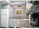 This kitchen has stainless steel appliances, granite countertops and a dining area with a view of the outdoors at 2941 Lichen Ln # B, Clearwater, FL 33760