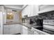Bright kitchen featuring granite countertops, stainless steel appliances, and modern cabinetry for a stylish and functional space at 2941 Lichen Ln # B, Clearwater, FL 33760