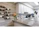 Stylish kitchen features a wine rack, stainless steel appliances, granite counters, and a tile backsplash at 2941 Lichen Ln # B, Clearwater, FL 33760