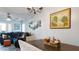 Cozy living room adjacent to the dining area with a comfortable sofa at 2941 Lichen Ln # B, Clearwater, FL 33760