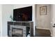 Cozy living room features a fireplace and mounted television at 2941 Lichen Ln # B, Clearwater, FL 33760