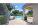 Community pool area featuring chaise lounges and seating with an adjacent spa at 2941 Lichen Ln # B, Clearwater, FL 33760