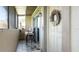 Outdoor patio with seating and a door adorned with a colorful wreath at 2941 Lichen Ln # B, Clearwater, FL 33760