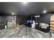 Spacious basement with modern flooring, versatile for use as a recreational room, home theater, or gym at 31949 Amberlea Rd, Dade City, FL 33523