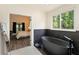 Bright bathroom with a freestanding tub, hex tile accent wall, and bedroom view at 31949 Amberlea Rd, Dade City, FL 33523