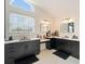Bathroom featuring dual sinks, vanity areas, and bright natural lighting at 31949 Amberlea Rd, Dade City, FL 33523