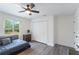 Cozy bedroom with a large window, closet, and neutral-toned walls at 31949 Amberlea Rd, Dade City, FL 33523