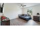 Bright bedroom featuring hardwood floors, a ceiling fan, and a comfortable daybed at 31949 Amberlea Rd, Dade City, FL 33523
