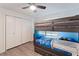 Bedroom showcasing a bunk bed, ample closet space and plenty of light at 31949 Amberlea Rd, Dade City, FL 33523