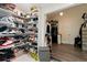A spacious walk-in closet featuring shoe rack and clothing storage with hanging lights at 31949 Amberlea Rd, Dade City, FL 33523