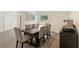 Dining room features an eight seat table set, modern floors, and plenty of light at 31949 Amberlea Rd, Dade City, FL 33523
