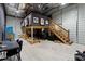 Expansive garage features a loft area, a table with chairs, and an arcade machine at 31949 Amberlea Rd, Dade City, FL 33523