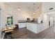 Open kitchen offers white cabinetry, granite countertops, and stainless steel appliances at 31949 Amberlea Rd, Dade City, FL 33523
