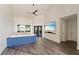 Bright living room boasts high ceilings, neutral tones, and a large tv at 31949 Amberlea Rd, Dade City, FL 33523