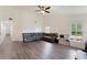 Spacious living room with hardwood floors, comfortable seating, and lots of natural light at 31949 Amberlea Rd, Dade City, FL 33523