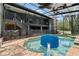Backyard view showcasing a screened pool area, perfect for enjoying outdoor recreation and relaxation at 31949 Amberlea Rd, Dade City, FL 33523