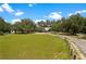 Expansive property with green pastures, mature trees, and a home with an extended driveway at 31949 Amberlea Rd, Dade City, FL 33523