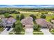 An aerial view of a home nestled among lush trees and backing up to a picturesque green space at 32624 Summerglade Dr, Wesley Chapel, FL 33545