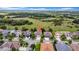 An aerial view of a home backing up to a picturesque green space with a nearby neighborhood at 32624 Summerglade Dr, Wesley Chapel, FL 33545