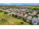 An aerial view of a property in a community close to a large green space at 32624 Summerglade Dr, Wesley Chapel, FL 33545